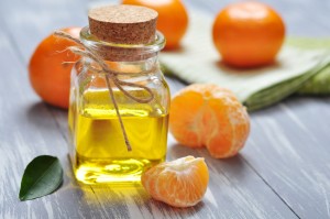 tangerine oil in a glass bottle